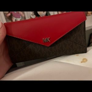 Mk wallet. Fits a lot of credit cards and in good condition!
